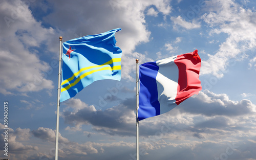 Beautiful national state flags of Aruba and France together at the sky background. 3D artwork concept.