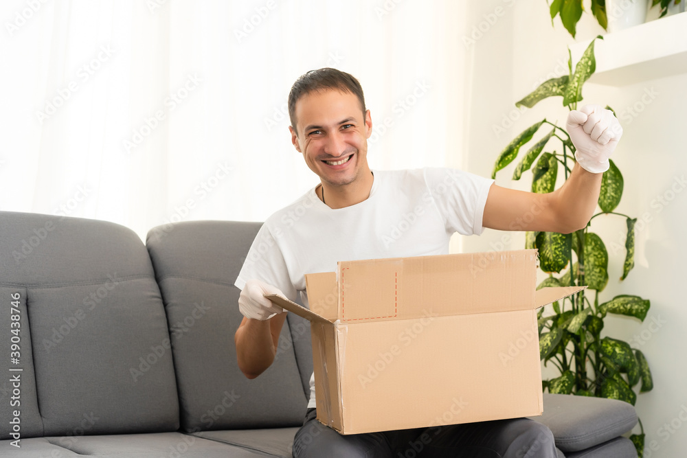 post, home and lifestyle concept - smiling man with cardboard boxes at home post, home and lifestyle concept - smiling man with cardboard boxes at home