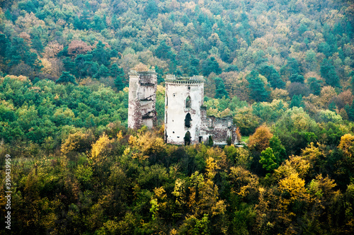 medieval castle in the forest. ancient ruined tower. dilapidated fortress. ruins of a knightly fortification. remains of the citadel