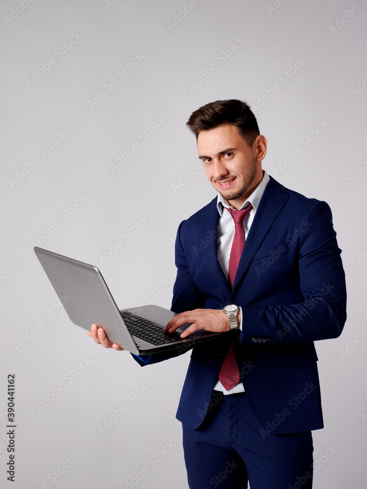 Young and elegant man consulting interne through his computer Young and elegant man consulting interne through his computer