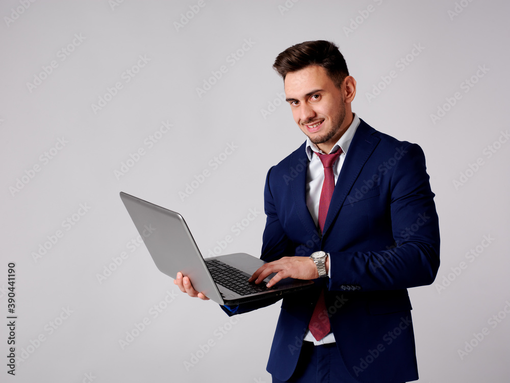 Young and elegant man consulting interne through his computer Young and elegant man consulting interne through his computer