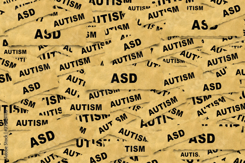 Abstract background from pieces of paper with the inscription ASD ( Autism spectrum disorder)