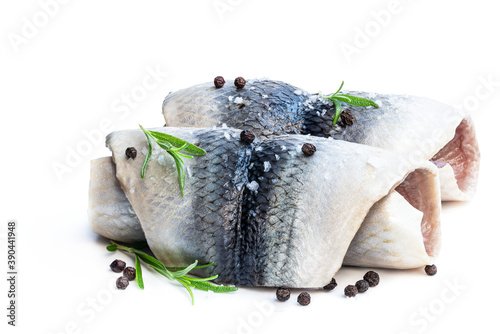 Marinated herring rolls with herbs isolated on white