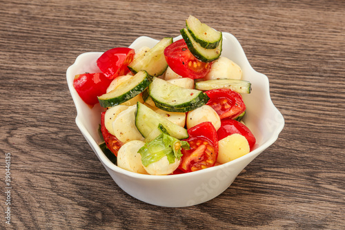 Salad with vegetables and mozzarlla photo