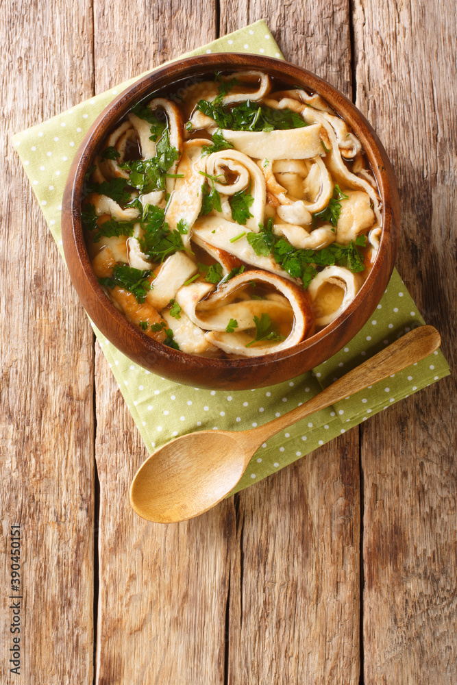 Recipe for Pancake or Crepe Soup Frittaten Suppe close-up in a plate on the table. vertical top view from above Recipe for Pancake or Crepe Soup Frittaten Suppe close-up in a plate on the table. vertical top view from above