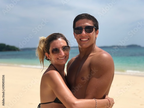 very happy couple enjoying the beach