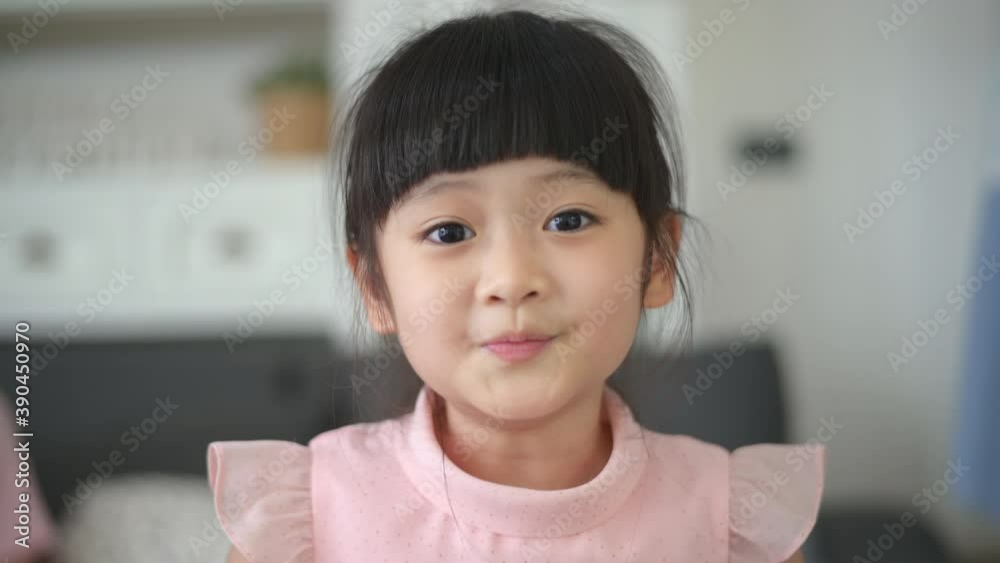 Headshot adorable asian girl is smiling in her house Headshot adorable asian girl is smiling in her house