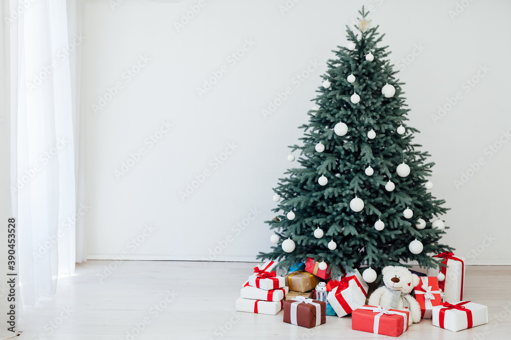 Door opening into a beautiful living room decorated for Christmas Door opening into a beautiful living room decorated for Christmas