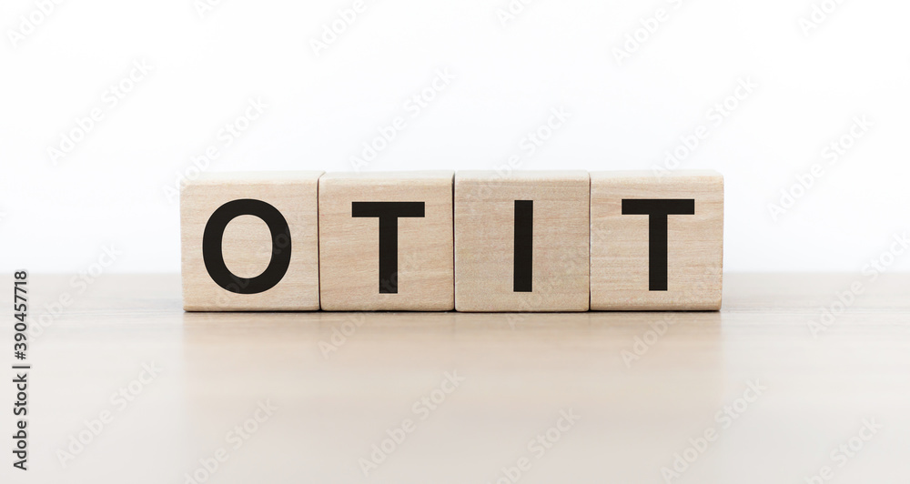OTIT inscription on wooden cubes on the table, light background cubes isolated isolated OTIT inscription on wooden cubes on the table, light background cubes isolated isolated