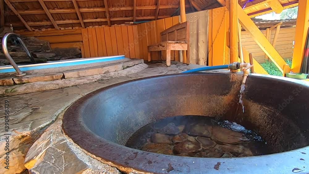 Chan in mountain. Large cauldron, tub or pool with hot or warm mineral water. Chan in mountain. Large cauldron, tub or pool with hot or warm mineral water.