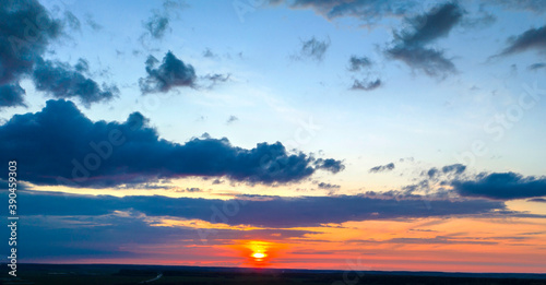 Clouds at sunset, amazing sky, nature background © yauhenka