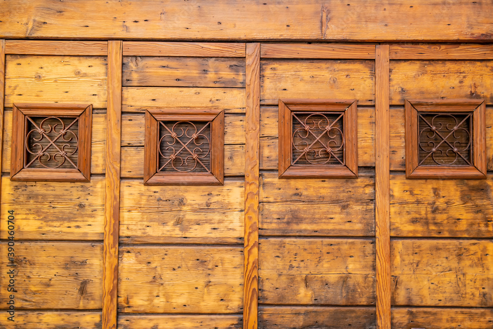 Small windows on wooden wall Small windows on wooden wall