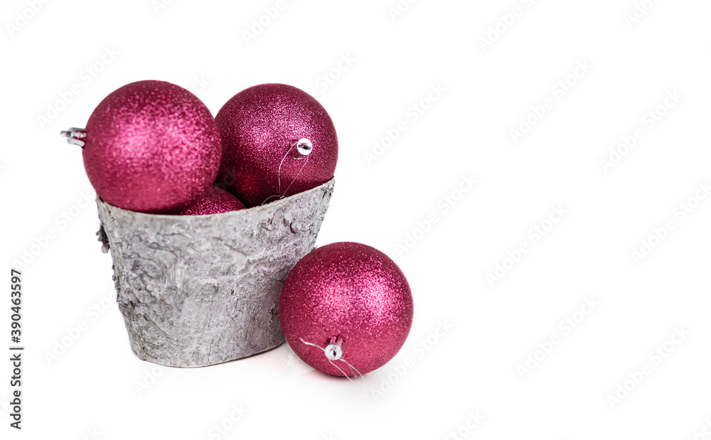 Purple Christmas balls in a basket. White background. Isolate. Purple Christmas balls in a basket. White background. Isolate.