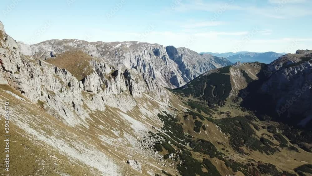 A drone shot of slopes in the Hochschwab region in Austria. The slopes are overgrown with golden grass, and few bushes below. Upper parts steep and sharp. Early spring in the mountains. Serenity
A drone shot of slopes in the Hochschwab region in Austria. The slopes are overgrown with golden grass, and few bushes below. Upper parts steep and sharp. Early spring in the mountains. Serenity
