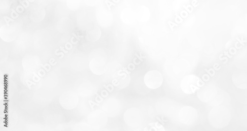 A brilliant blurry white background for a festive mood. Template for greeting card for entertainment.