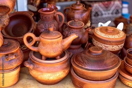 Handmade clay tableware for sale to tourists, kettle, saucepan,