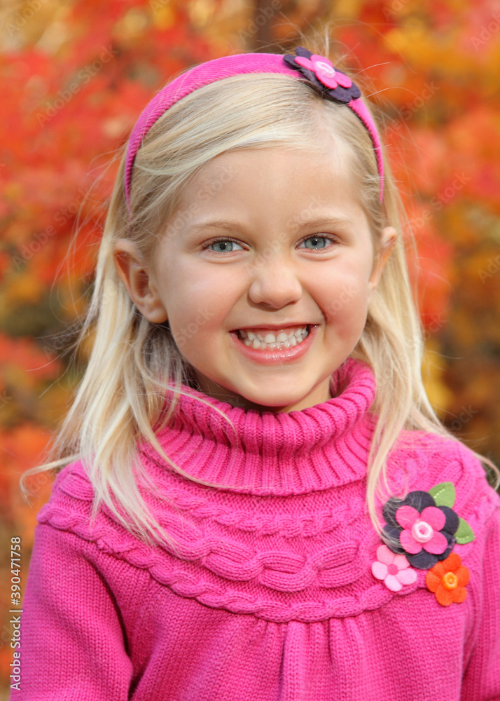closeup of pretty little blond girl outdoors in autumn closeup of pretty little blond girl outdoors in autumn