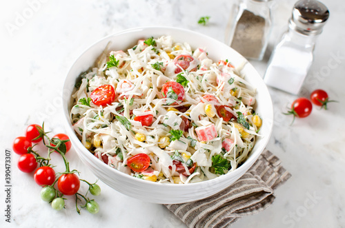 Salad with crab sticks, cabbage and tomatoes