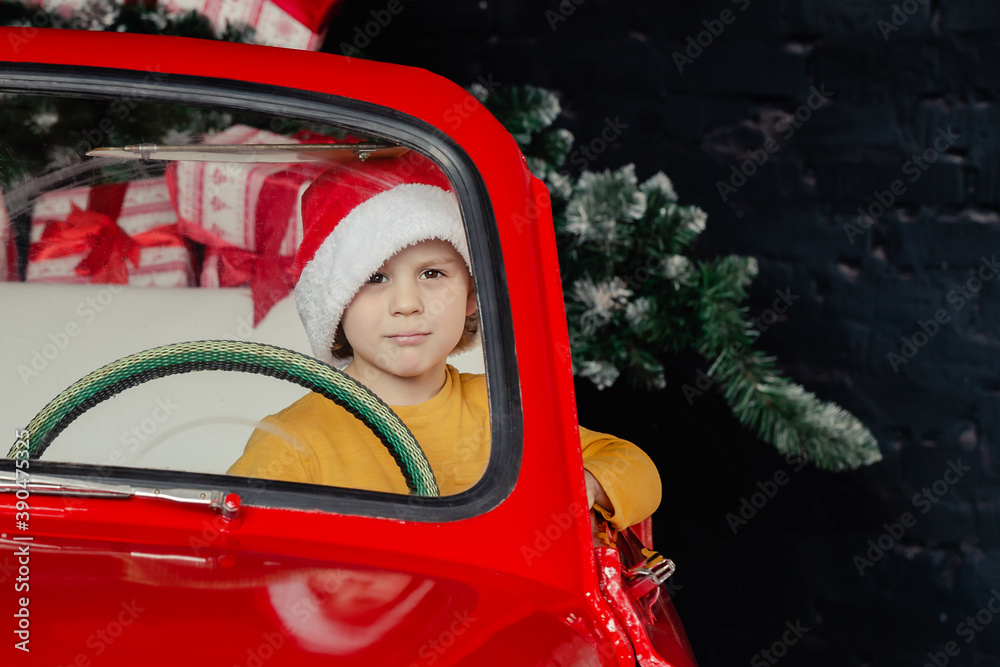 child in Santa hat with present child in Santa hat with present