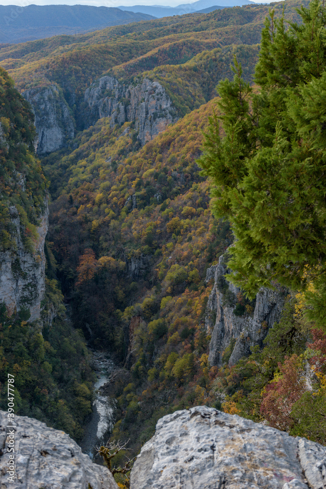 vieww of  Vikos Gorge, the deepest gorge in Europe, with fall colors near tsepelovo  in Zagori Epirus, Greece.