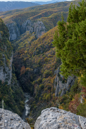 vieww of Vikos Gorge, the deepest gorge in Europe, with fall colors near tsepelovo in Zagori Epirus, Greece.