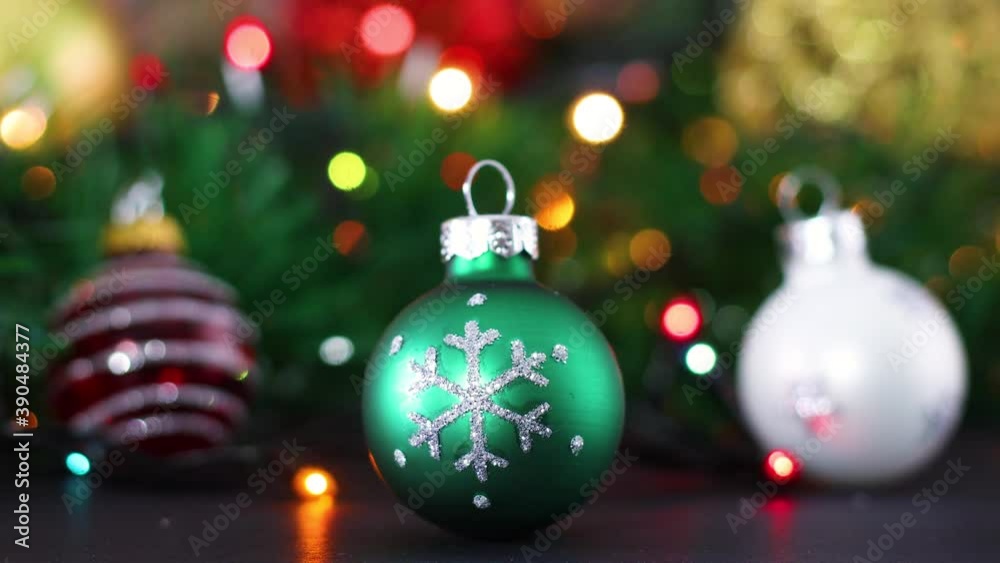 Three Christmas ornaments, green, red and white with blinking lights Three Christmas ornaments, green, red and white with blinking lights