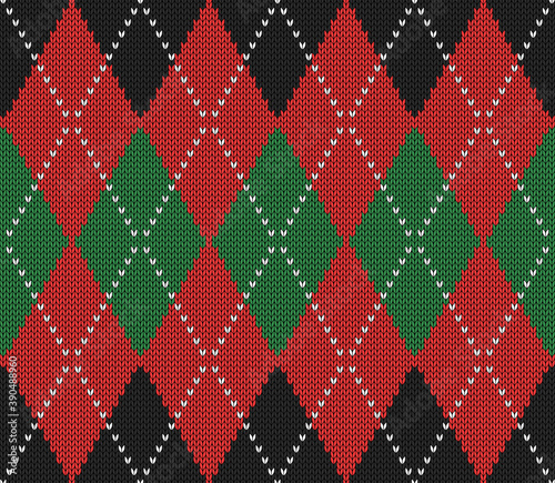 Knitted argyle Christmas and new year pattern. Wool knitinng. Scottish plaid in red, black and green rhombuses. Traditional  background of diamonds. Seamless fabric texture. Vector illustration