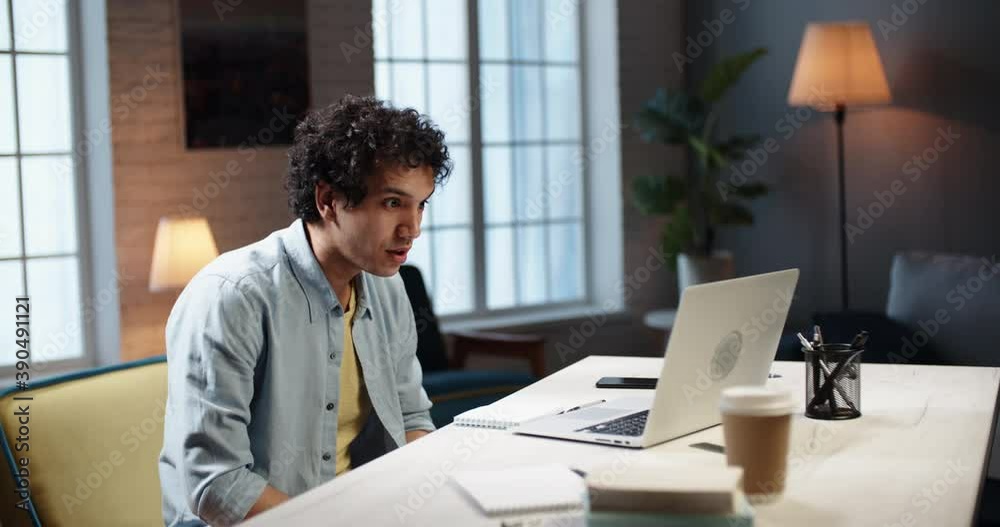 Portrait of young happy asian guy getting shocked during video chat. Student finds out about his application. Worker getting employed for a dream job 4k footage Portrait of young happy asian guy getting shocked during video chat. Student finds out about his application. Worker getting employed for a dream job 4k footage