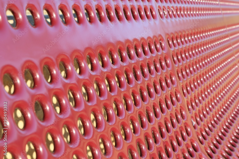 Fototapeta premium Perforated red surface
