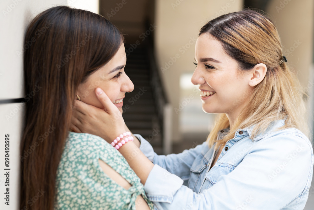Young gay woman holding the face of her partner Young gay woman holding the face of her partner
