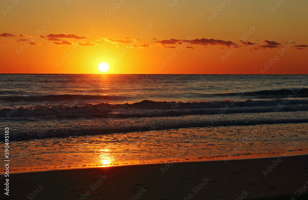 A golden sunrise on the beach, Mediterranean sea