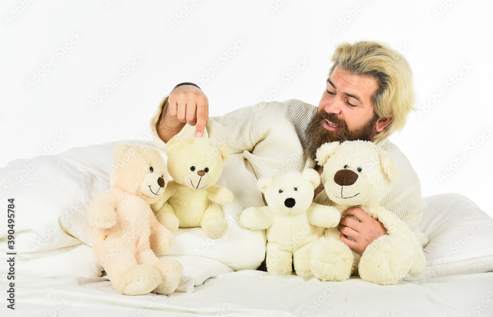 present toy. Handsome hipster hold lovely bear toy. Happy Valentines day. Sick man with flu lying in the bed. sleeping at home in bed with his toy. man sleeping in embrace with white teddy bear present toy. Handsome hipster hold lovely bear toy. Happy Valentines day. Sick man with flu lying in the bed. sleeping at home in bed with his toy. man sleeping in embrace with white teddy bear