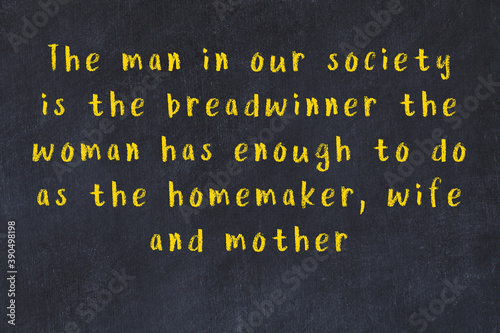 Black chalkboard with wise inscription on it