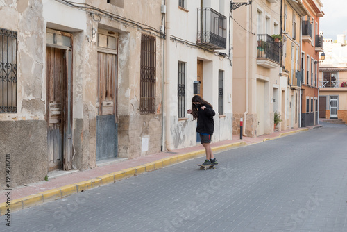 Wallpaper Mural Young boy practices skateboarding, wears a mask against coronavirus and allergic diseases. Torontodigital.ca