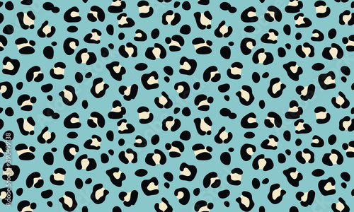 Seamless pattern of leopard texture background elements. Hand-drawn leopard texture in black and white color on a blue background. Trendy animalistic colorful background for textile, fabric, paper. 