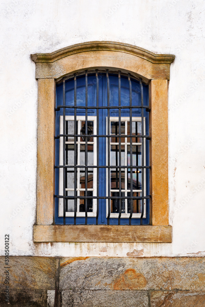 Ancient colonial window in historical city of Ouro Preto, Brazil