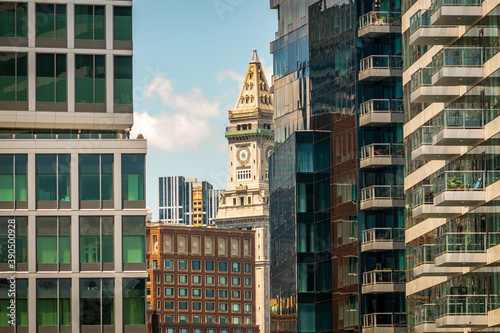 An historic Boston skyscraper, through the new glass buildings of the Seaport photo