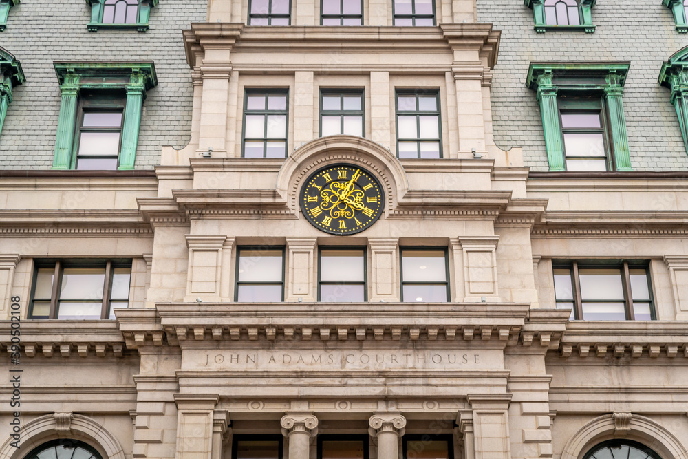 The clock above the entrance of a courthouse in Boston