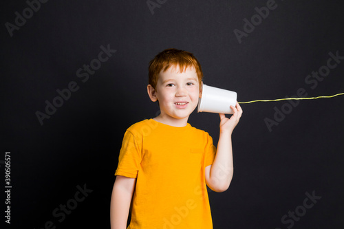 portrait of a nice boy with red hair