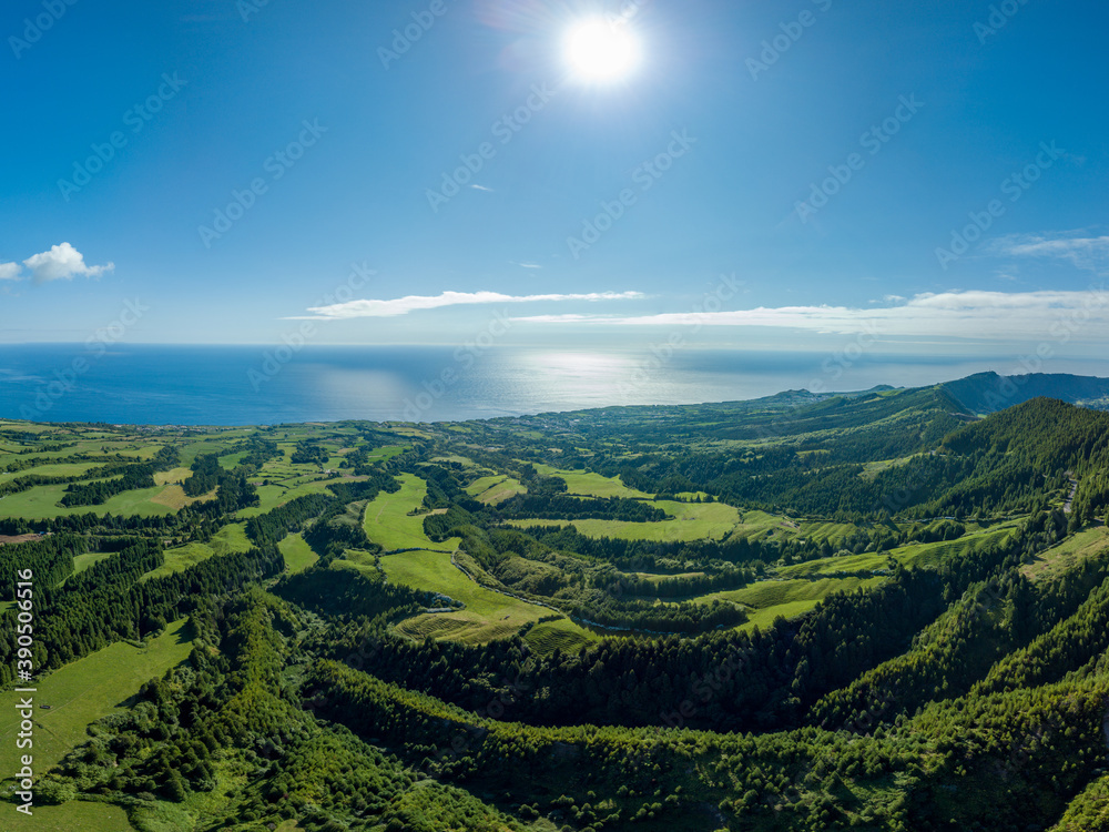 Panoramic view over the green landscape and the Atlantic ocean, in the North Coast of the island of São Miguel in the Azores. Panoramic view over the green landscape and the Atlantic ocean, in the North Coast of the island of São Miguel in the Azores.