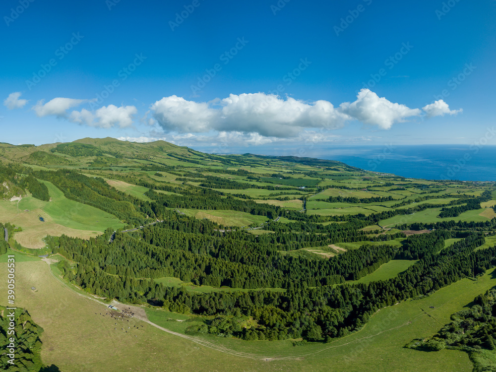 Panoramic view over the majestic green landscape and the Atlantic ocean, in the North Coast of the island of São Miguel in the Azores.