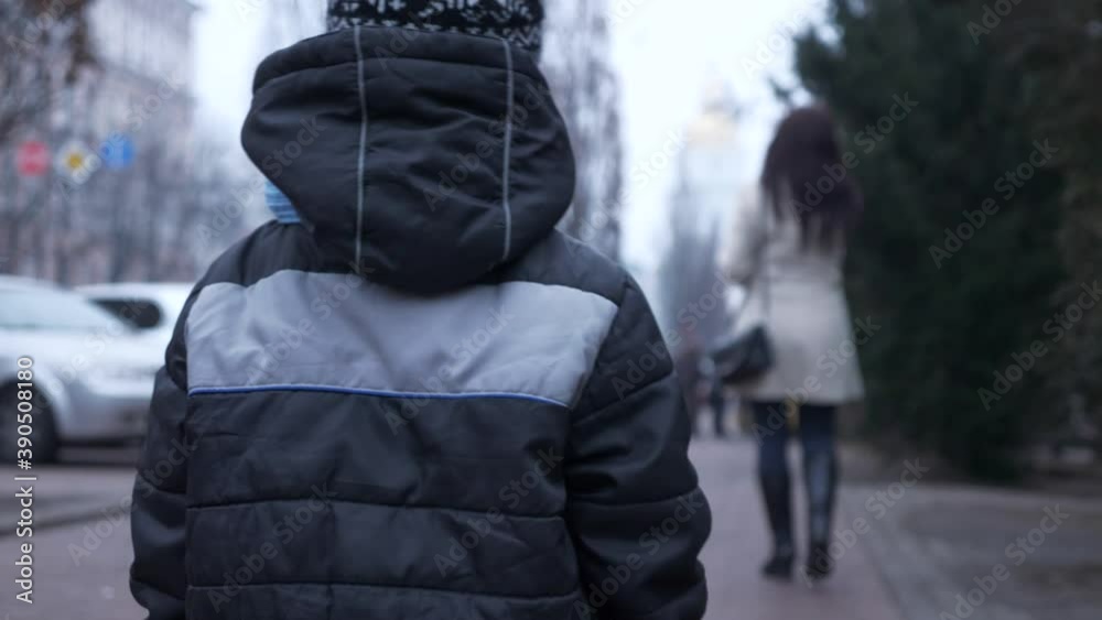 Lost Child Stands Alone amid City Street and Looking Around. Son lost Mother. Winter Evening. 2x Slow motion 60 fps Lost Child Stands Alone amid City Street and Looking Around. Son lost Mother. Winter Evening. 2x Slow motion 60 fps