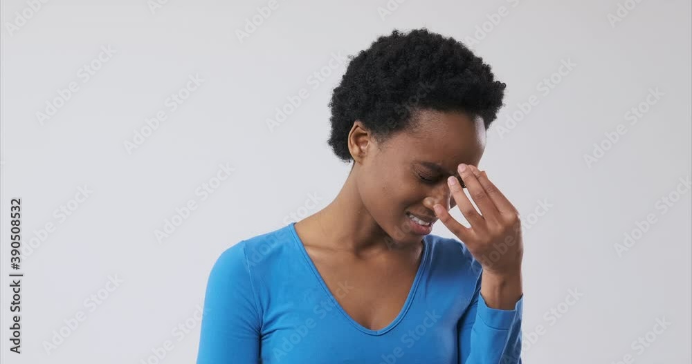 African american woman suffering from terrible headache African american woman suffering from terrible headache