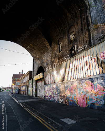 Graffiti art work under viaduct bridge arches, Birmingham