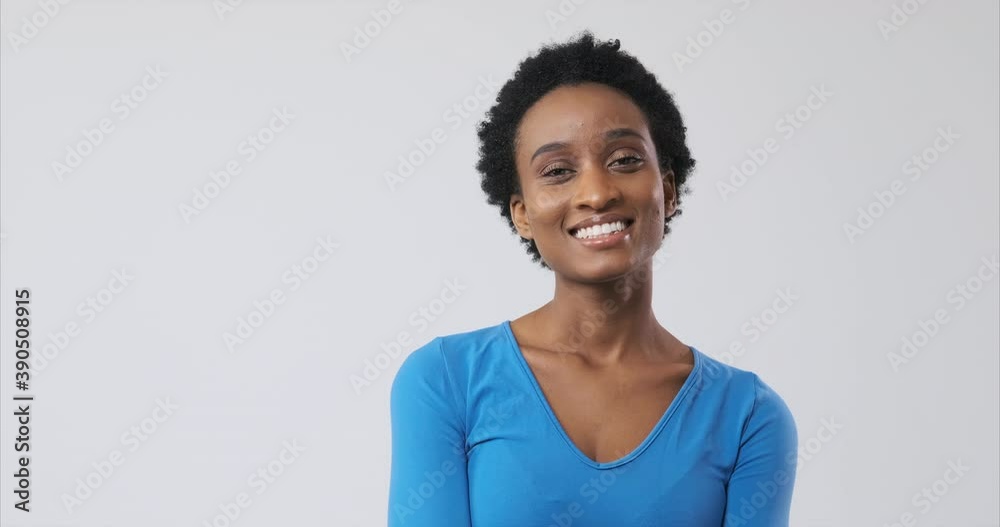 Beautiful african american woman smiling over white background Beautiful african american woman smiling over white background