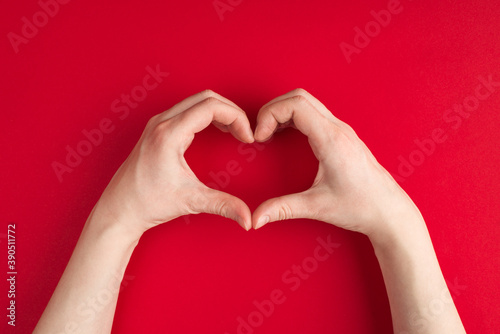 I love you declaration banner concept. Top above overhead close up first person view photo of female hands making showing heart shape symbol isolated over vibrant vivid color background