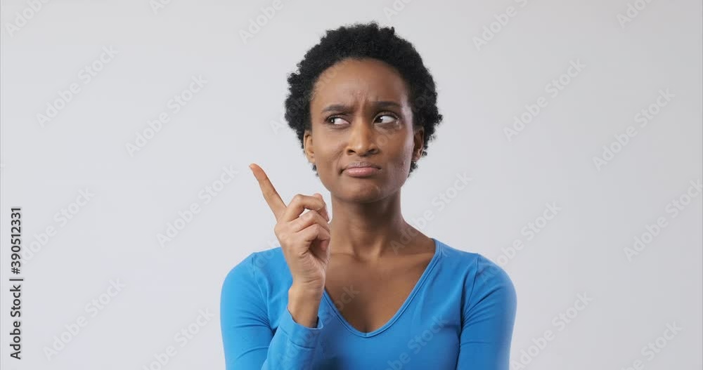 Confused african american woman coming up with a good idea Confused african american woman coming up with a good idea