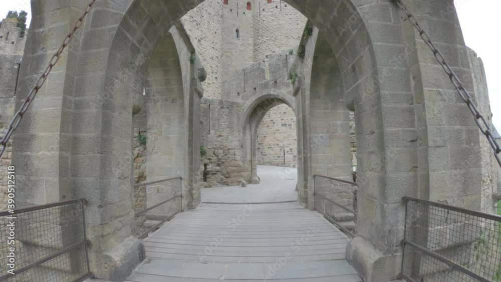 DOLLY - Fortifications of the medieval city of Carcassonne, France. The Narbonnaise gate, was built around 1280 during the reign of Philip III the Bold and was made up of two enormous spur towers. DOLLY - Fortifications of the medieval city of Carcassonne, France. The Narbonnaise gate, was built around 1280 during the reign of Philip III the Bold and was made up of two enormous spur towers.