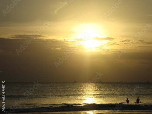 sunset on the beach © ozzuboy