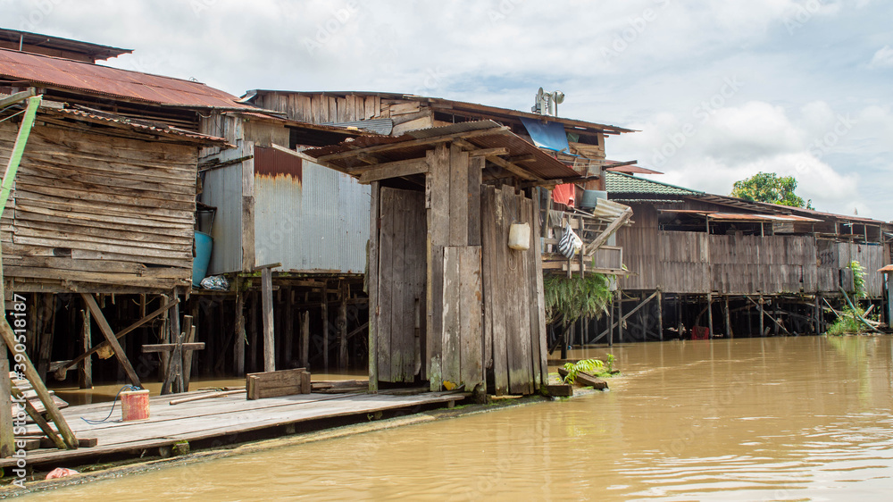 wooden toilet on Karang Mumus riverbank, Samarinda. Slum area of Samarinda, Indonesia